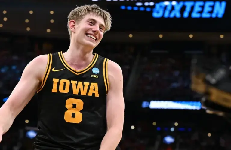 Iowa Hawkeyes forward Cooper Koch (8) reacts after beating the Nebraska Cornhuskers during a Sweet Sixteen game