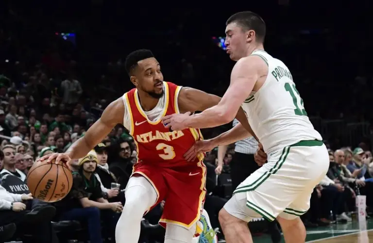 Atlanta Hawks guard CJ McCollum (3) dribbles against Boston Celtics guard Payton Pritchard (11)