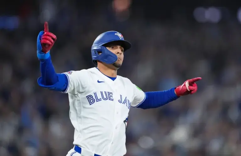 Toronto Blue Jays shortstop Andres Gimenez (0) celebrates after hitting a walk off single.