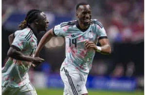 Belgium’s Dodi Lukebakio reacts with Jeremy Doku after scoring a goal against the USMNT