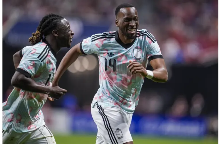 Belgium’s Dodi Lukebakio reacts with Jeremy Doku after scoring a goal against the USMNT