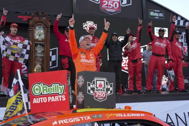 Mar 28, 2026; Martinsville, Virginia, USA; JR Motorsports driver Justin Allgaier (7) celebrates his win with his crew after the race at Martinsville Speedway.