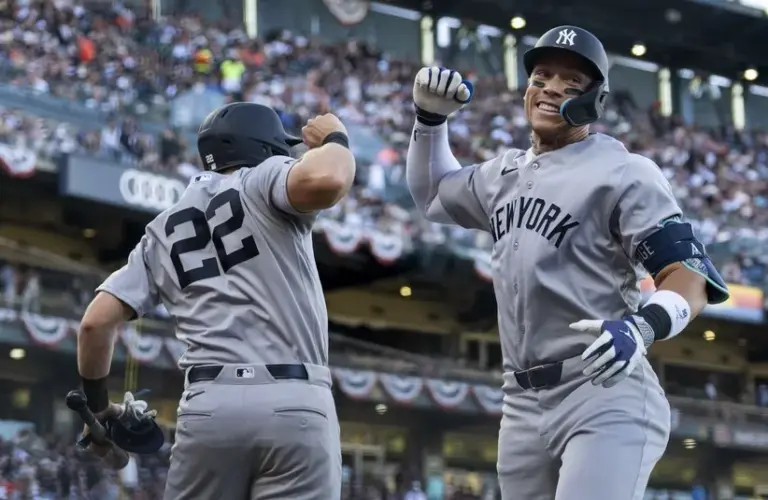 New York Yankees right fielder Aaron Judge (99) is congratulated.