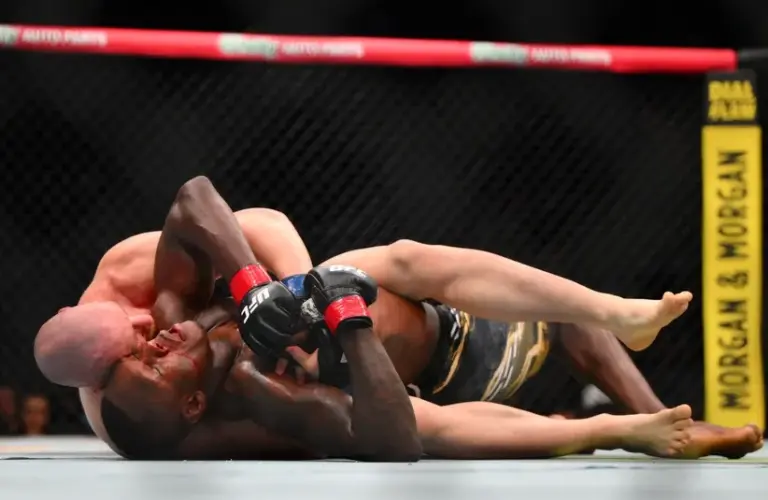 Israel Adesanya (red gloves) fights Joe Pyfer (blue gloves) during UFC Fight Night at Climate Pledge Arena