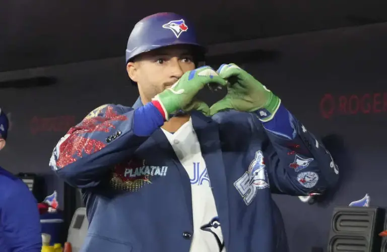 Toronto Blue Jays designated hitter George Springer (4) shows the heart symbol.