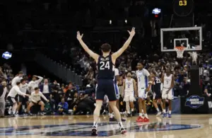 UConn Huskies guard Braylon Mullins (24) celebrates after making the game-winning three-point basket