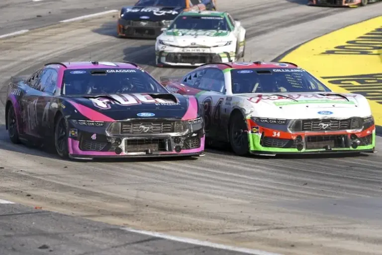 Mar 29, 2026; Martinsville, Virginia, USA; Front Row Motorsports driver Todd Gilliland (34) and Front Row Motorsports driver Noah Gragson (4) compete through turn four at Martinsville Speedway.