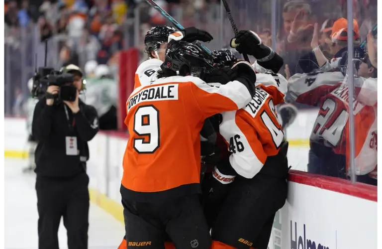 Trevor Zegras in the middle of the mob of Flyers players