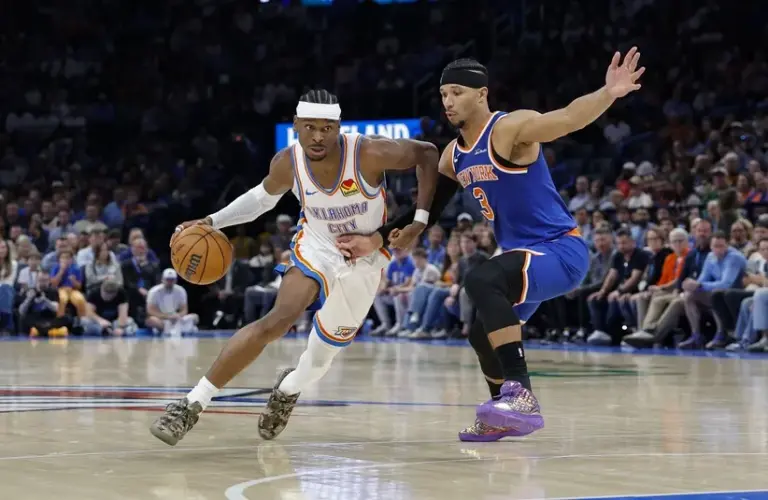 Oklahoma City Thunder guard Shai Gilgeous-Alexander (2) drives around New York Knicks guard Josh Hart (3)