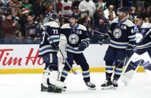 Mar 17, 2026; Columbus, Ohio, USA; Columbus Blue Jackets goalie Jet Greaves (73) and defenseman Zach Werenski (8) celebrate the win after the game against the Carolina Hurricanes at Nationwide Arena.