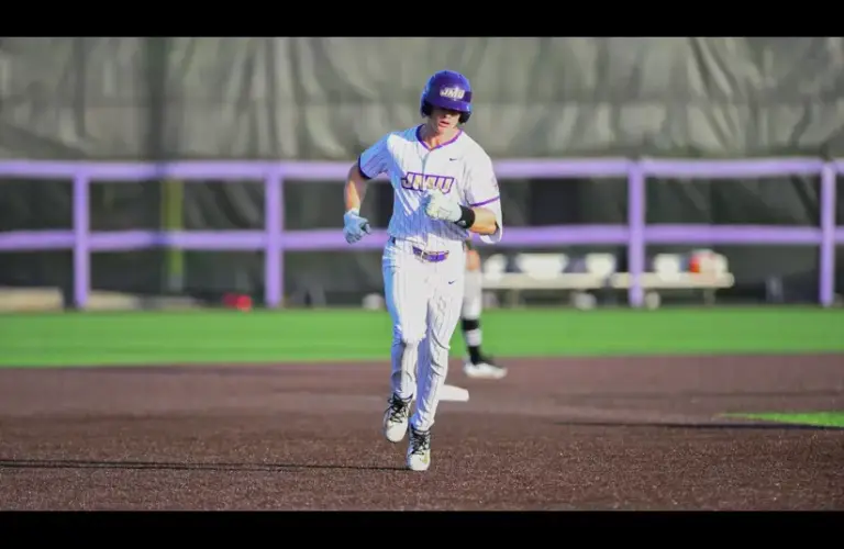 Clay Thompson of James Madison rounds the bases after hitting a home run.