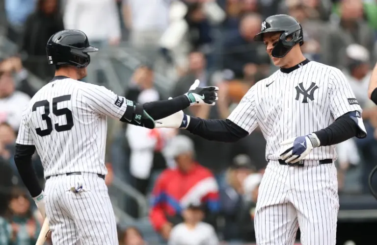 New York Yankees right fielder Aaron Judge (99) celebrates with left fielder Cody Bellinger (35) after hitting a two run home run during the first inning against the Miami Marlins at Yankee Stadium.