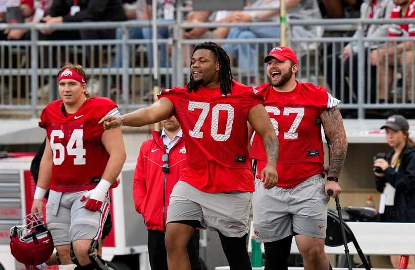 Offensive lineman Phillip Daniels (70) and Austin Siereveld (67) tease their teammate in the first half of the Ohio State football spring game at Ohio Stadium on Saturday, April 18, 2026 in Columbus, Ohio.