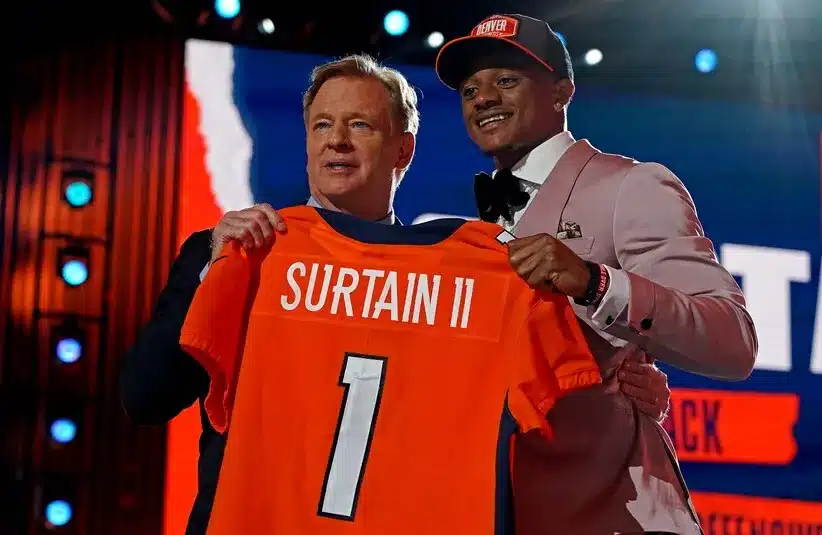 Patrick Surtain Jr. (Alabama) with NFL commissioner Roger Goodell after being selected by Denver Broncos as the number nine overall pick in the first round of the 2021 NFL Draft at First Energy Stadium.