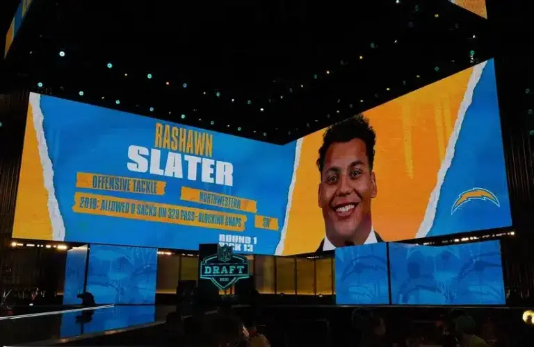 Northwestern Wildcats offensive lineman Rashawn Slater is displayed on the video board after being selected as the 13th pick by the Los Angeles Chargers during the 2021 NFL Draft at First Energy Stadium.