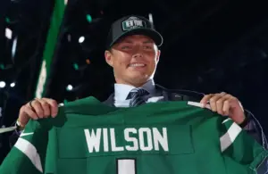 BYU quarterback Zach Wilson poses with jersey after being selected as the second pick by the New York Jets during the 2021 NFL Draft at First Energy Stadium.
