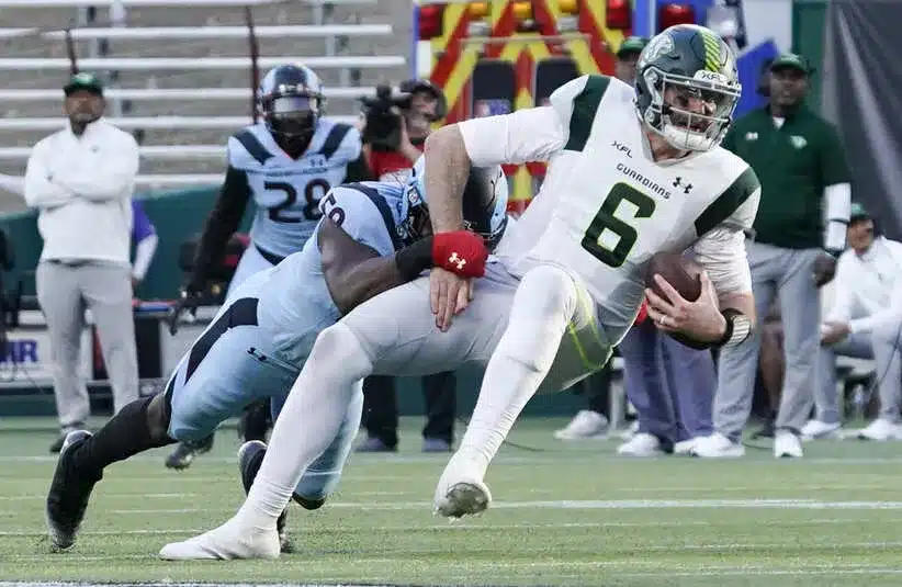 Orlando Guardians quarterback Paxton Lynch (6) is sacked.