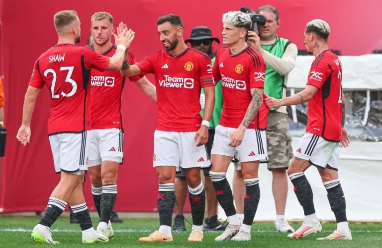 Bruno Fernandes celebrating with his team mates.