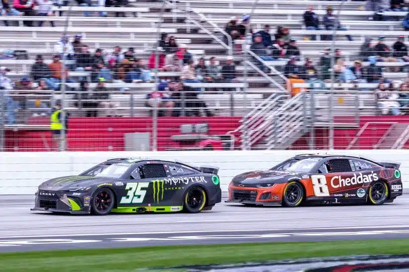 Moran; Feb 23, 2025; Hampton, Georgia, USA; Riley Herbst (35) and Kyle Busch (8) battle for position going into turn one at Atlanta Motor Speedway.