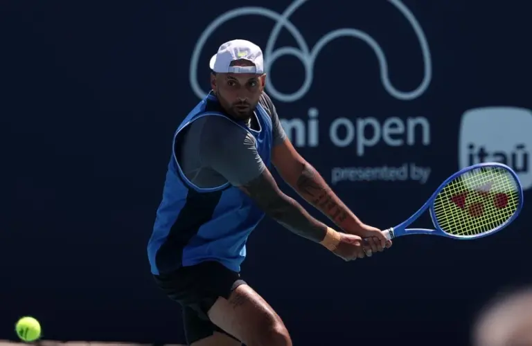 Kyrgios hitting a backhand shot