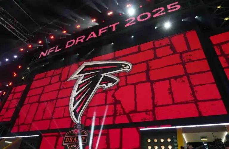 The Atlanta Falcons logo is projected on the video board during the NFL Draft.