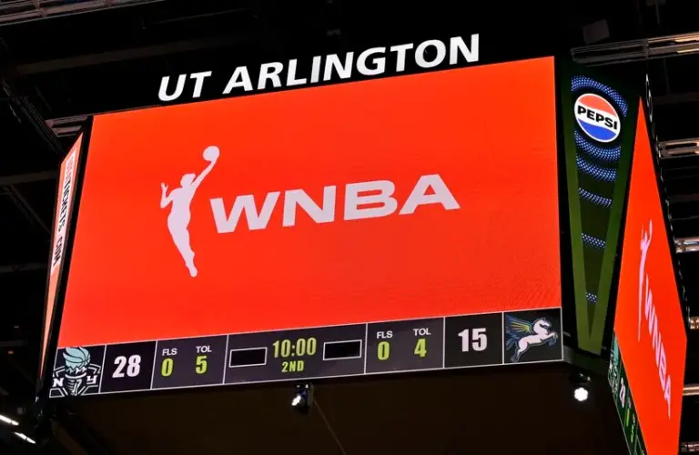 A view of the scoreboard and the WNBA logo as an announcement is made about throwing any toys or objects on to the court during the first half of the game etween the Dallas Wings and the New York Liberty at College Park Center.