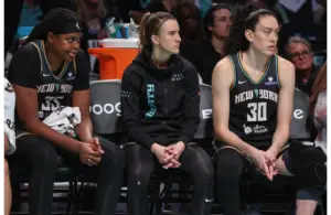 The New York Liberty Big 3 looking on the action from the bench