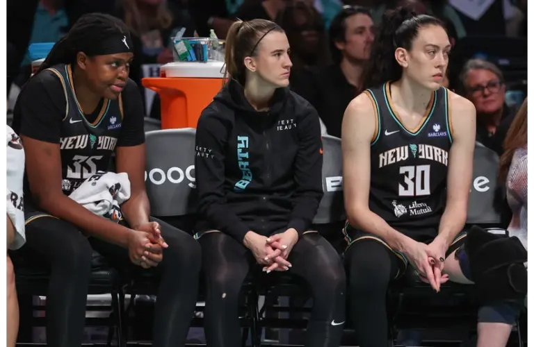 The New York Liberty Big 3 looking on the action from the bench