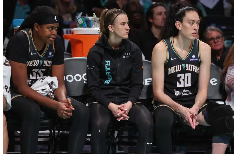 The New York Liberty Big 3 looking on the action from the bench
