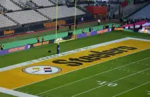 A Pittsburgh Steelers logo in the end zone.