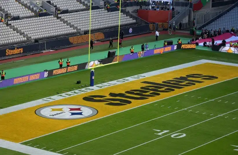 A Pittsburgh Steelers logo in the end zone.