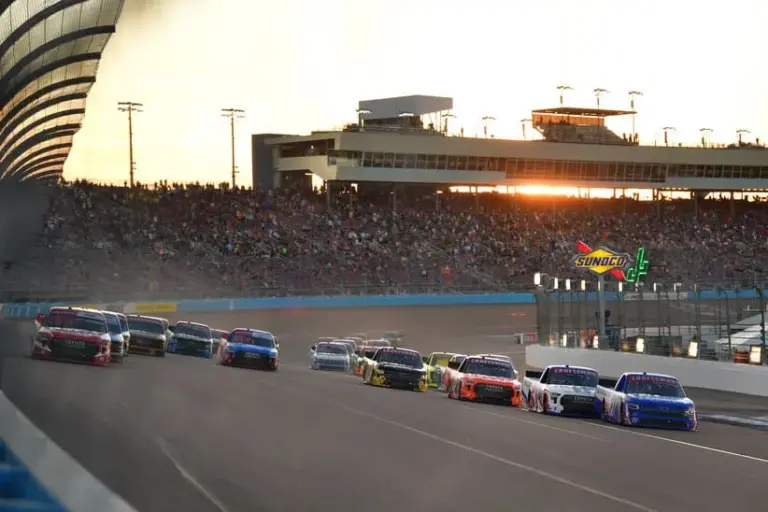 Rockingham; Oct 31, 2025; Avondale, Arizona, USA; NASCAR Gander RV and Outdoors Truck Series driver Corey Heim (11) and driver Rajah Caruth (71) lead the restart during the Craftsman Truck Series Championship race at Phoenix Raceway.