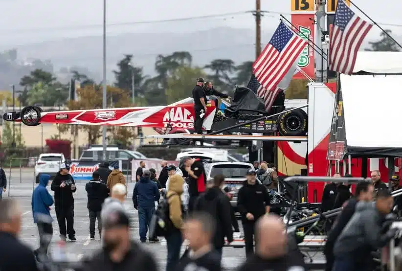 Cacklefest; Nov 14, 2025; Pomona, CA, USA; The dragster of NHRA top fuel driver Doug Kalitta is loaded into the hauler during a rain delay to qualifying for the NHRA Finals at In-N-Out Burger Pomona Dragstrip. Racing would be cancelled due to weather.