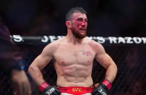 Merab Dvalishvili (red gloves) during the fight against Petr Yan.