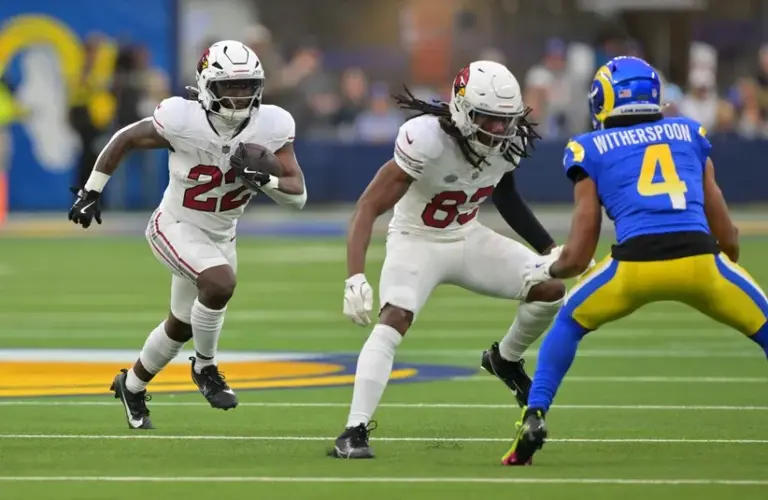 Arizona Cardinals running back Michael Carter (22) carries the ball.