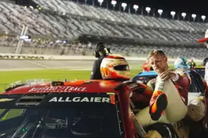 Justin Allgaier of JR Motorsports climbs into his car during Daytona 500 qualifying, Wednesday, Feb. 11, 2026, at Daytona International Speedway.