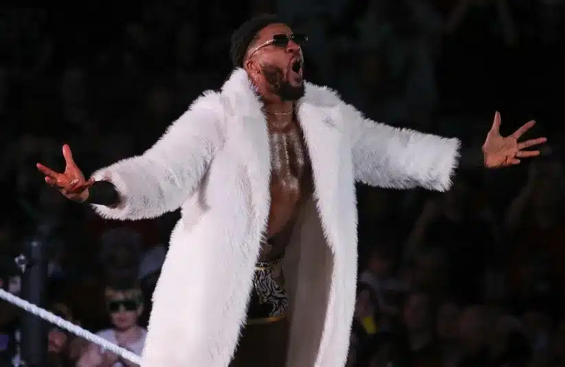 Trick Williams poses on the turnbuckle before a match during the WWE Road to WrestleMania show.