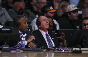 Announcer Dick Vitale looks on.