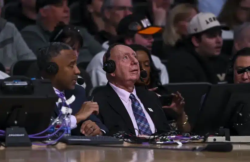 Announcer Dick Vitale looks on.