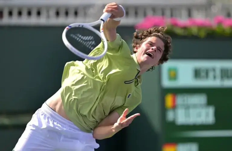 Alexander Blockx (BEL) hits a shot during his qualifying match.