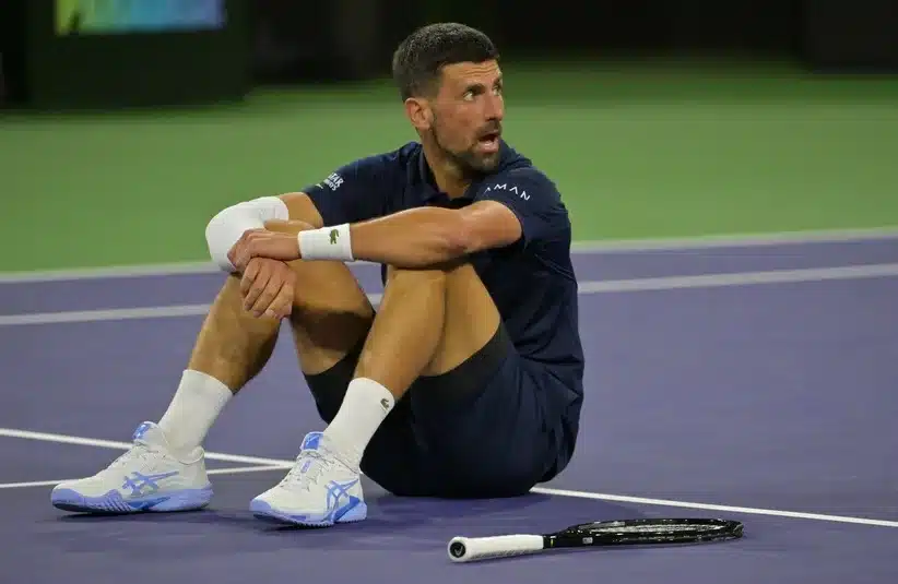Djokovic sitting on the Indian Wells court