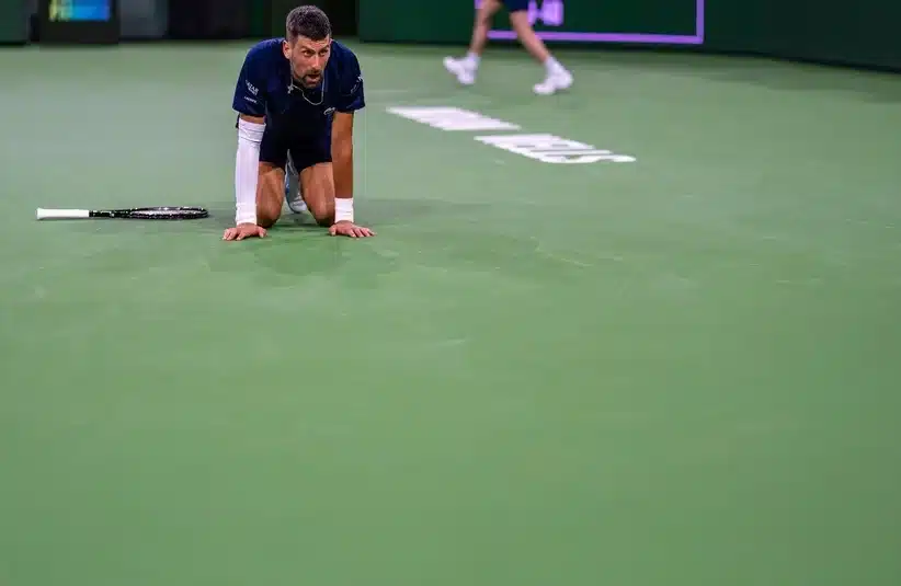 Novak Djokovic hitting the ground
