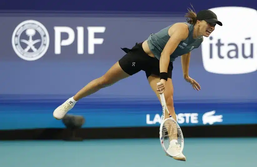 Swiatek preparing to hit a serve