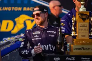 Mar 22, 2026; Darlington, South Carolina, USA; 23XI Racing Tyler Reddick (45) celebrates in Victory Lane after winning at Darlington Raceway.