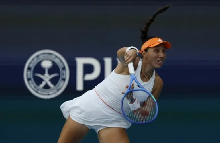 Pegula hitting her serve