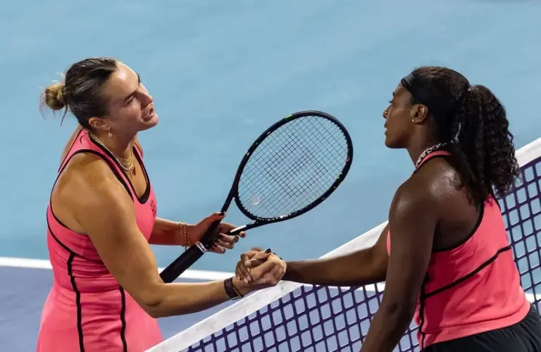 Aryna Sabalenka of Belarus shakes hands after defeating Hailey Baptiste of the United States.