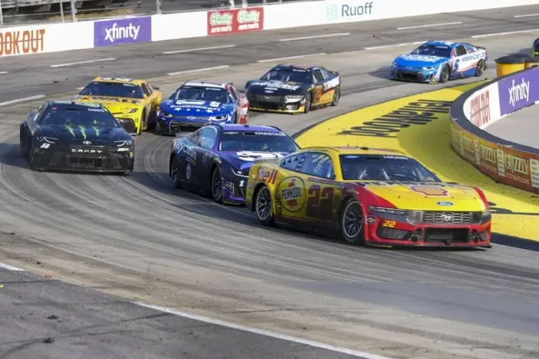 Cup Series; Mar 29, 2026; Martinsville, Virginia, USA; Team Penske driver Joey Logano (22) passes driver Ross Chastain (1) out of turn four at Martinsville Speedway.