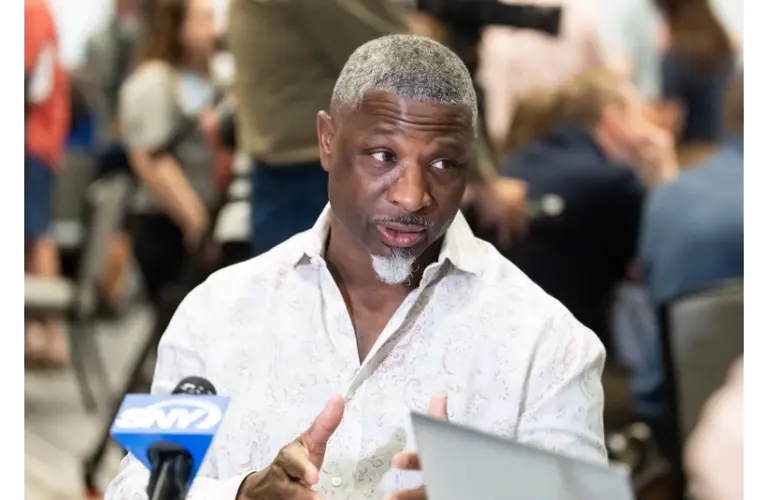 Aaron Glenn talking to the media