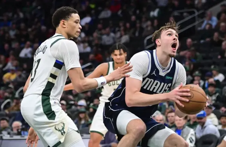 Dallas Mavericks forward Cooper Flagg (32) looks for a shot.