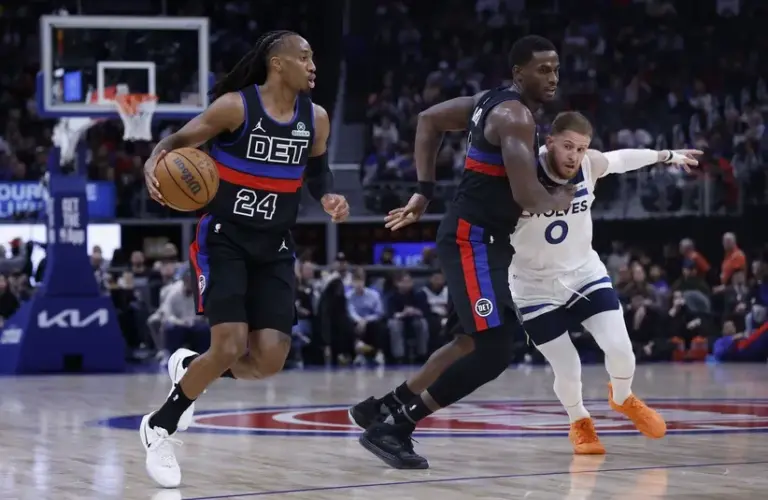 Detroit Pistons guard Daniss Jenkins (24) dribbles.